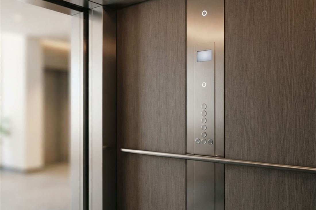 A designer lift cabin ceiling with cove lighting